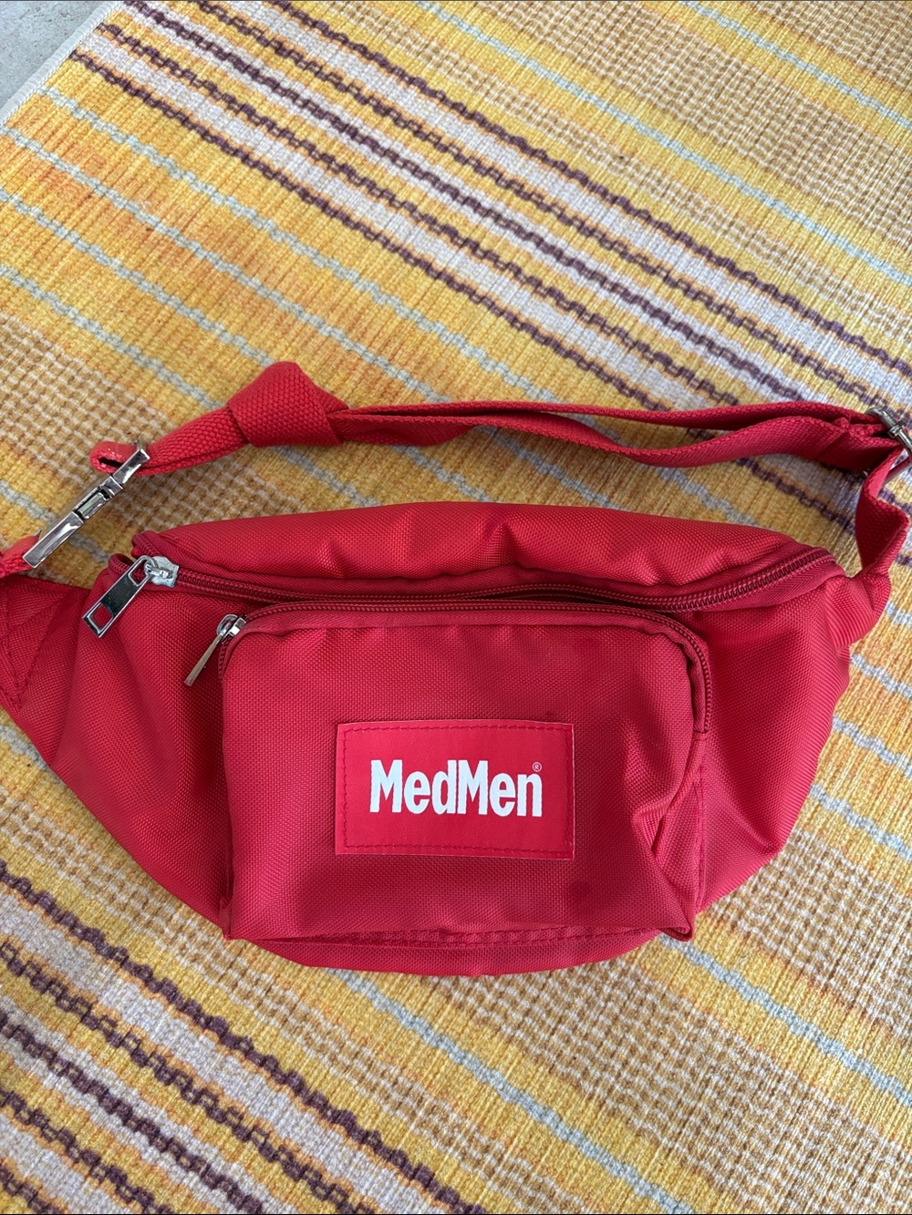 MedMen red nylon Fanny pack with adjustable strap and cool metal clip
